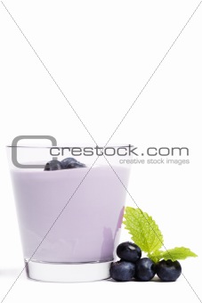some blueberries with melissa near a milkshake