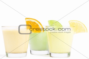 three cold citrus fruit milkshakes