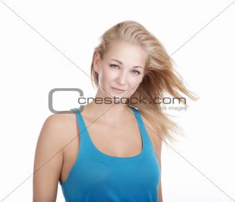 portrait of a young blond woman in blue top - isolated on white