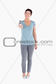 Smiling woman showing a mobile phone