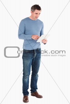 Handsome man using a tablet computer