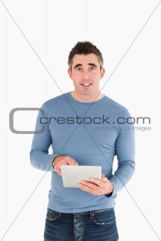 Portrait of a man holding a tablet computer