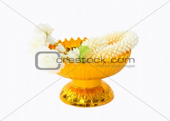 Jasmine garland on gold tray with pedestal