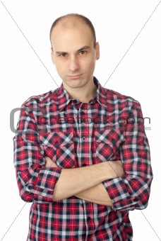 young man with a serious look and crossed arms