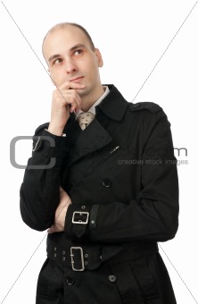 handsome businessman thinking and looking up