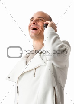 man smiling and talking on a mobile phone