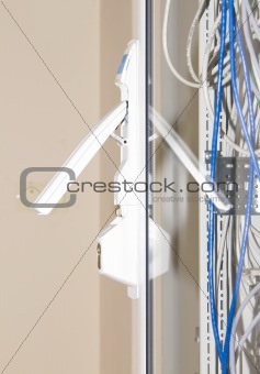 Telecom rack with glass door and locked handle