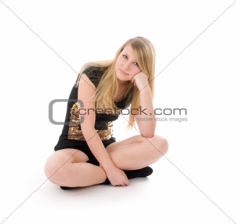 Portrait of beautiful woman sitting on the floor