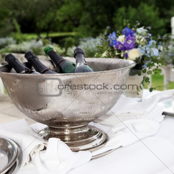 Many bottles of champagne in a champagne cooler