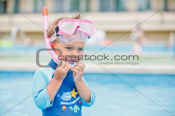 boy playing in a pool of water