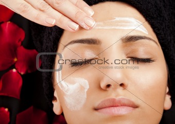 Applying face cream