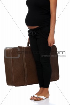 Pregnant woman with old suitcase