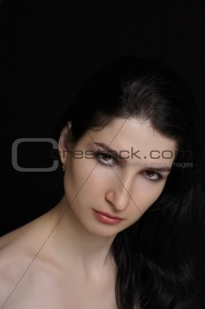 Beautiful young woman on the black background