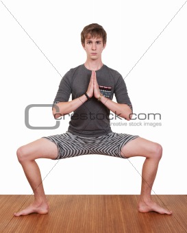 Young Man Practices Yoga