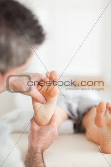 Woman getting a reflexology massage