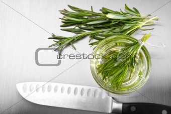 Rosemary leaves with cutting on stainless steel 