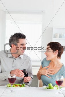 Man proposing to his cute girlfriend