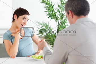 Handsome Man proposing to smiling girlfriend