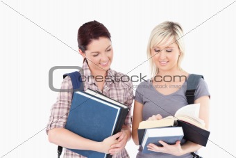 Female students reading a book