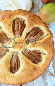 homemade cake with pears on a wooden table