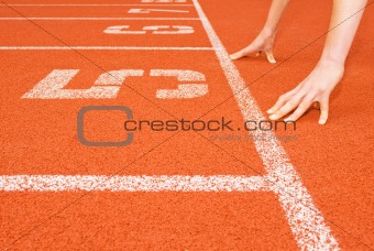 Runner's Hands at the Starting Line