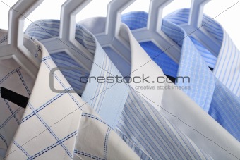 Five white-and-blue shirts
