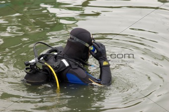 scuba diver entering the water