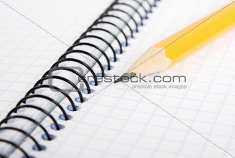 Blank notebook and pencil