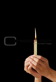 Hands and a candle
