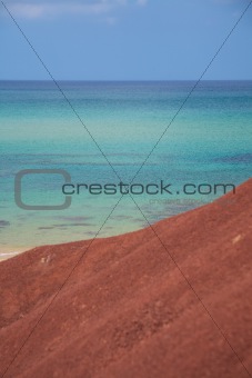 sea and red earth