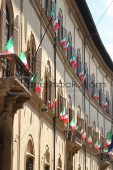 Italian flags outside of a windows
