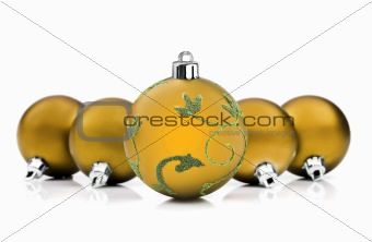 Golden christmas baubles on white background with space for text