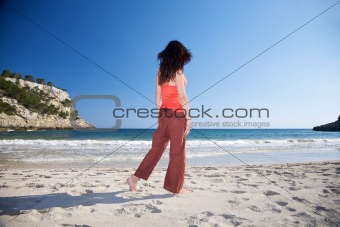 woman walking watching ocean