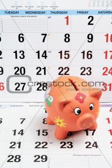 Piggy Bank on Calendar Pages
