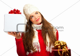 Beautiful young woman deciding what christmas present to buy.