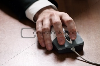 Computer mouse in hand businessman