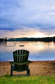 Wooden chair at sunset on beach