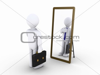 Businessman looking in the mirror