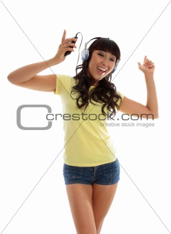 Vivacious girl listening to music and dancing