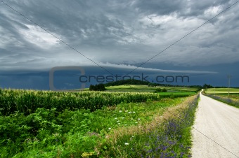 Storm Clouds Over a Country Road