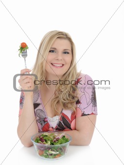 beautiful woman eating green vegetable salad. isolated on white 