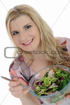 Pretty female eating green vegetable salad. isolated on white 