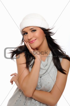 Expressions. Beautiful winter girl in a hat smiling. isolated