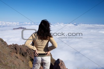 back woman over fog ocean