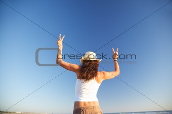 winner woman with two arms up