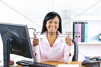 Businesswoman giving thumbs up