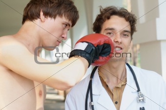Boxer punching a doctor