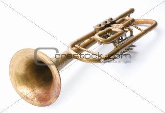Old vintage trumpet isolated over white