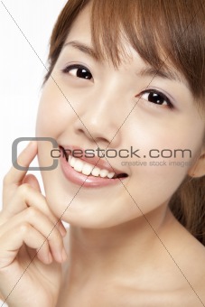 Happy beautiful asian woman's face with fresh clean skin