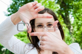 woman is focused view in the viewfinder gestures